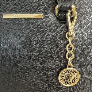 ANN KLEIN Black Pebbled Leather with Logo fob, polkadot interior lining .